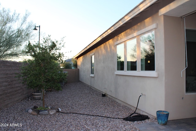 view of property exterior at dusk