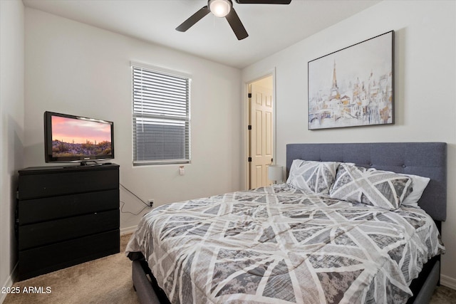 bedroom with carpet flooring, baseboards, and ceiling fan