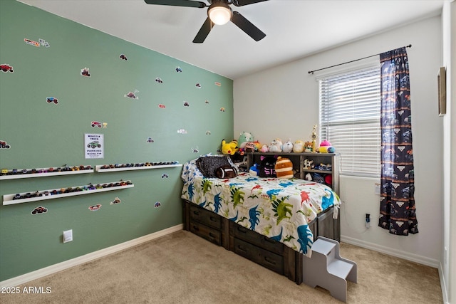 bedroom with baseboards, a ceiling fan, and carpet