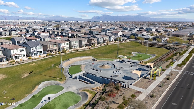 drone / aerial view with a residential view and a mountain view