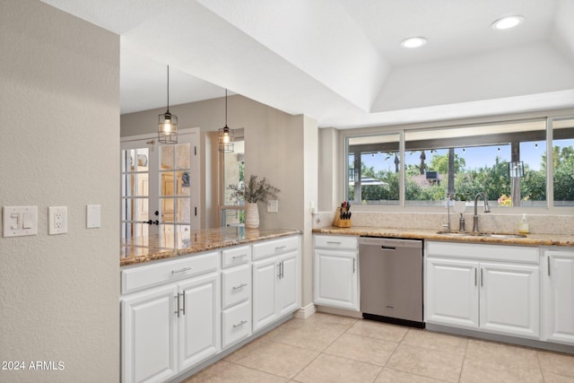 kitchen with white cabinetry, dishwasher, sink, hanging light fixtures, and light stone counters