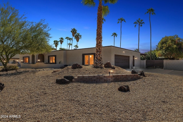 southwest-style home featuring a garage