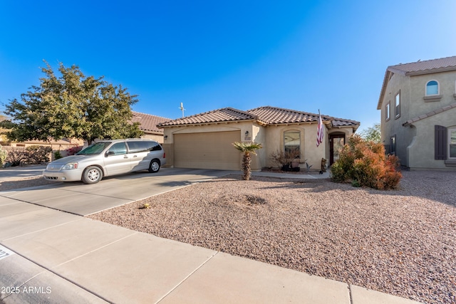 mediterranean / spanish-style home with a garage