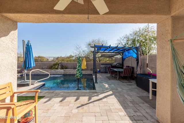 view of swimming pool with a patio, ceiling fan, and a pergola