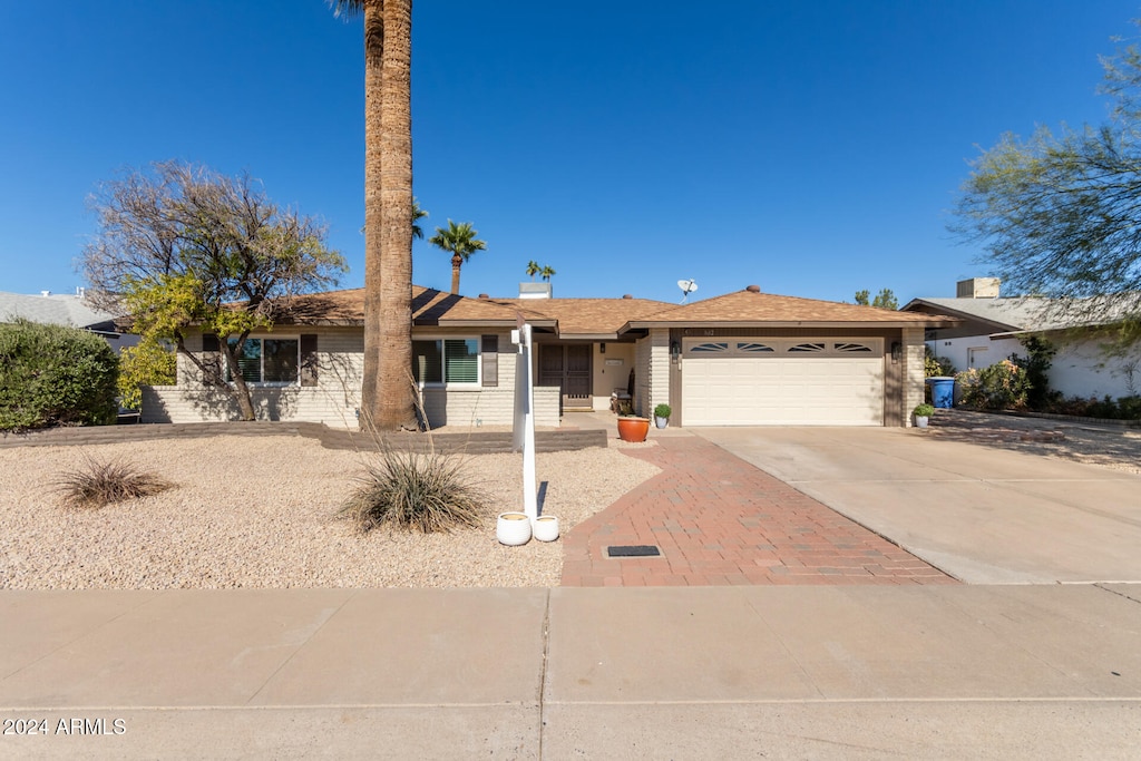 single story home featuring a garage