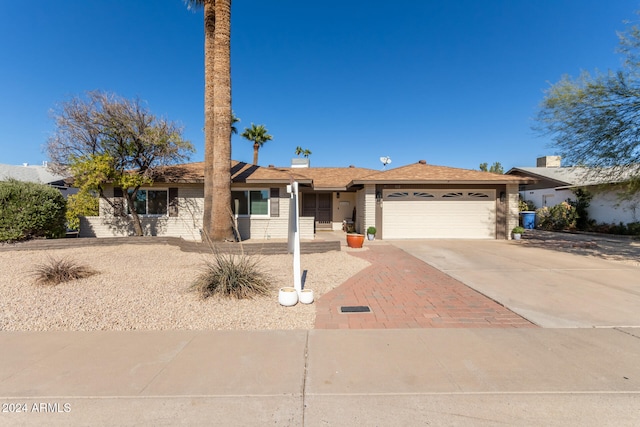 single story home featuring a garage