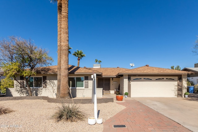 ranch-style house featuring a garage