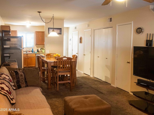 455 S Mesa Dr Unit 104, Mesa, AZ 85210 - living area featuring dark colored carpet and a ceiling fan