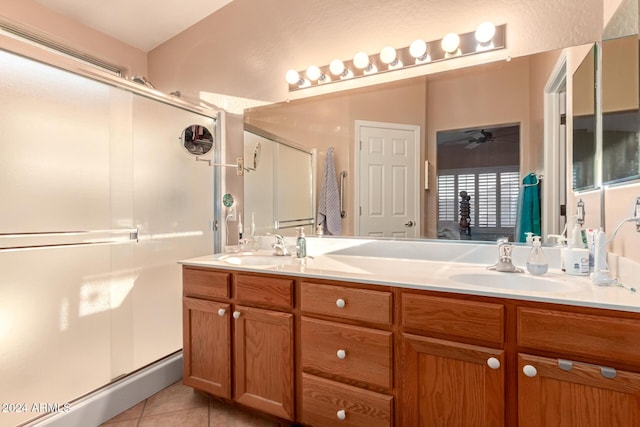 bathroom featuring an enclosed shower, vanity, tile patterned floors, and ceiling fan