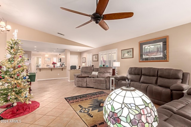 tiled living room featuring ceiling fan and lofted ceiling