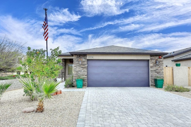 16705 E Almont Dr Unit A, Fountain Hills, AZ 85268 - view of front of property with a garage, fence, decorative driveway, and stone siding