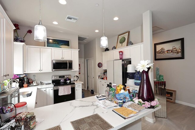 16705 E Almont Dr Unit A, Fountain Hills, AZ 85268 - kitchen with visible vents, hanging light fixtures, appliances with stainless steel finishes, and light countertops