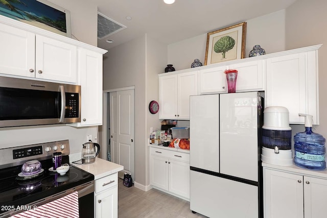 16705 E Almont Dr Unit A, Fountain Hills, AZ 85268 - kitchen with visible vents, stainless steel appliances, light countertops, and white cabinetry