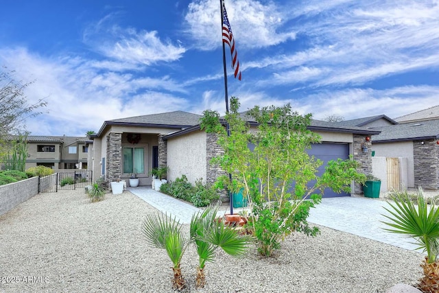 16705 E Almont Dr Unit A, Fountain Hills, AZ 85268 - view of front of property with fence, stucco siding, an attached garage, and stone siding