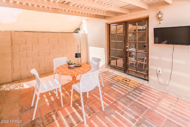 6945 E Osborn Rd Unit B, Scottsdale, AZ 85251 - dining space featuring concrete block wall