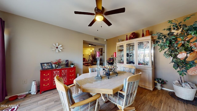 dining area featuring ceiling fan and light hardwood / wood-style floors