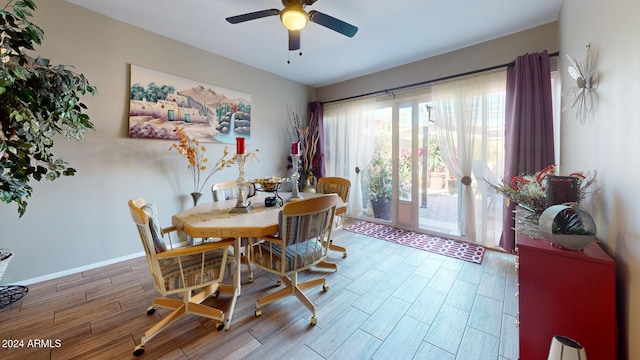 dining area with hardwood / wood-style floors and ceiling fan