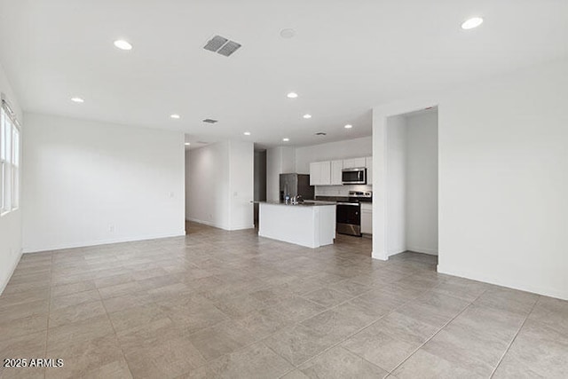 8474 W Clemente Way, Florence, AZ 85132 - unfurnished living room with recessed lighting and baseboards