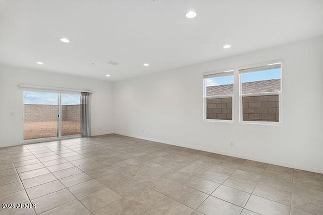 8474 W Clemente Way, Florence, AZ 85132 - empty room featuring recessed lighting, light tile patterned floors, and baseboards