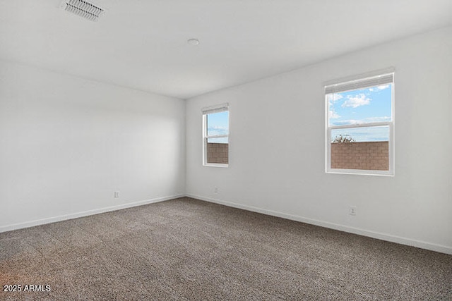 8474 W Clemente Way, Florence, AZ 85132 - empty room with carpet flooring and baseboards