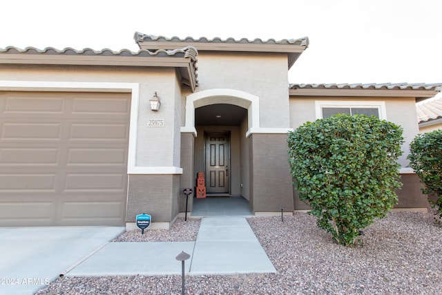 property entrance featuring a garage