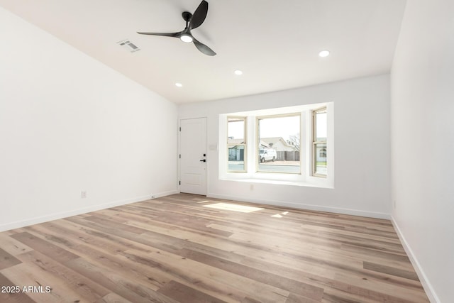 empty room featuring baseboards, visible vents, a ceiling fan, light wood-type flooring, and recessed lighting