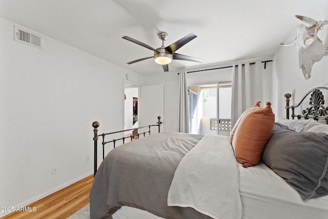 bedroom featuring visible vents, baseboards, ceiling fan, light wood-style flooring, and access to outside