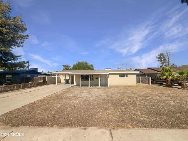 view of front of house with a carport