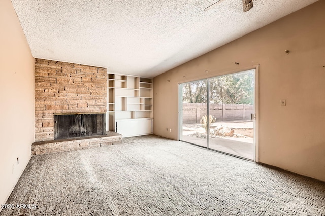 736 E Loyola Dr, Tempe, AZ 85282 - unfurnished living room featuring a textured ceiling, carpet floors, a fireplace, and lofted ceiling