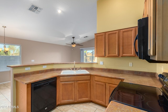 kitchen featuring lofted ceiling, light tile patterned flooring, black appliances, pendant lighting, and sink