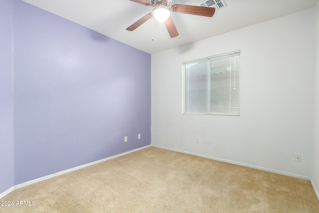 empty room with light carpet and ceiling fan