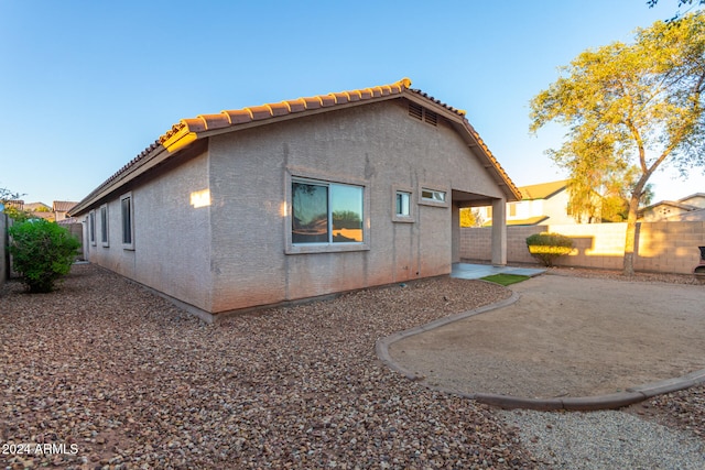 back of house with a patio area