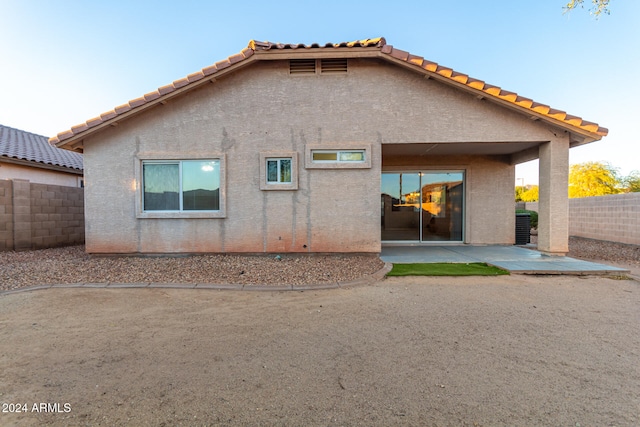 back of property with a patio area