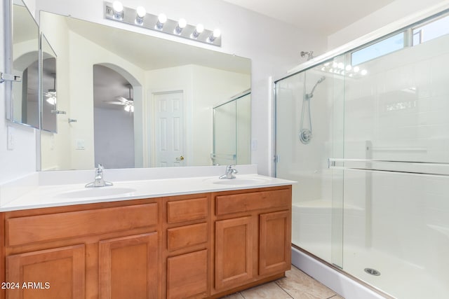 bathroom featuring vanity, tile patterned floors, ceiling fan, and an enclosed shower