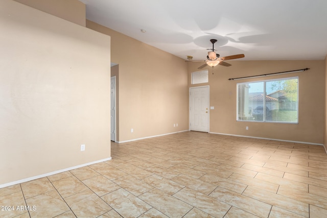 empty room with lofted ceiling and ceiling fan