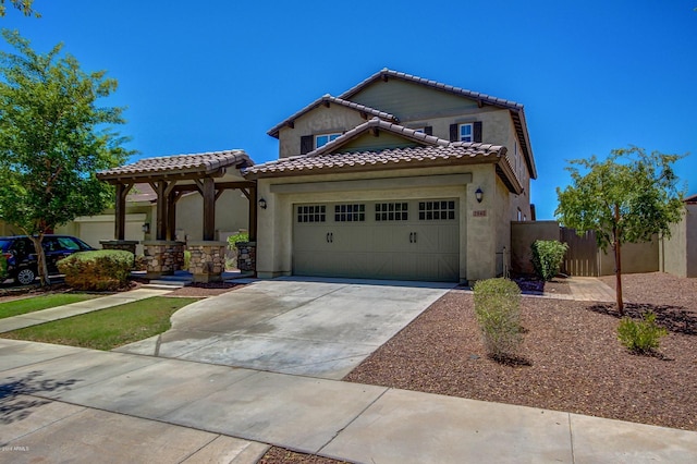 mediterranean / spanish home with a garage