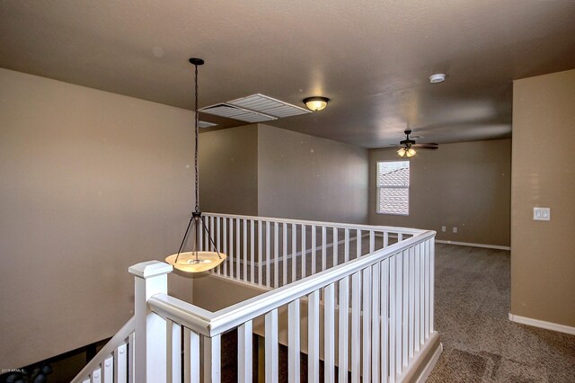 corridor with carpet flooring