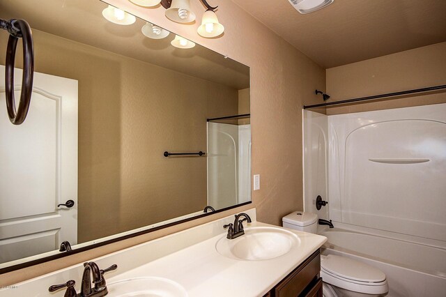 full bathroom featuring vanity, toilet, and bathtub / shower combination