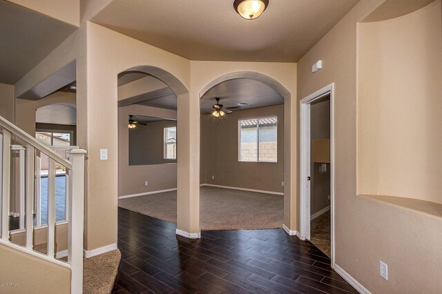 interior space with ceiling fan