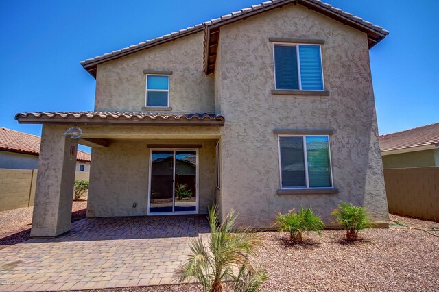 back of house featuring a patio area