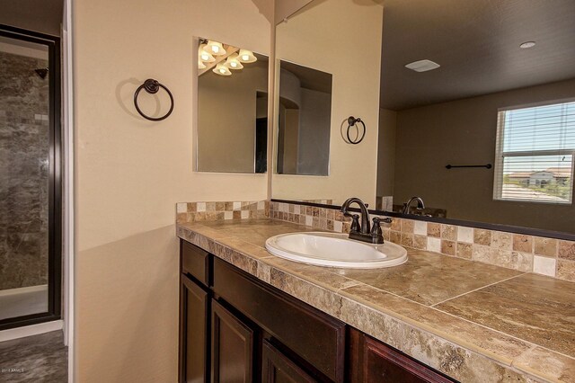 bathroom with vanity and walk in shower