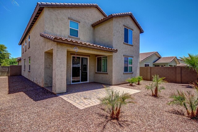 rear view of house featuring a patio area