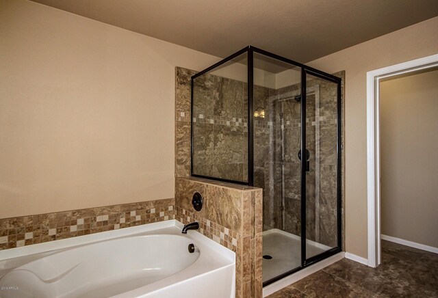 bathroom featuring independent shower and bath