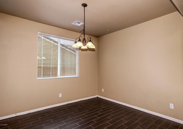 empty room with a chandelier