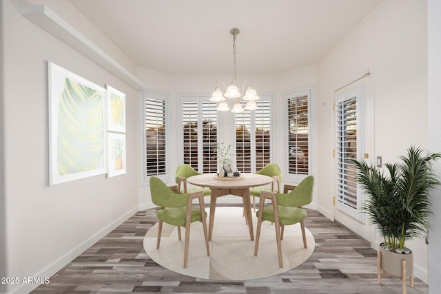 15583 W Big Sky Dr, Surprise, AZ 85374 - dining room featuring an inviting chandelier and hardwood / wood-style flooring
