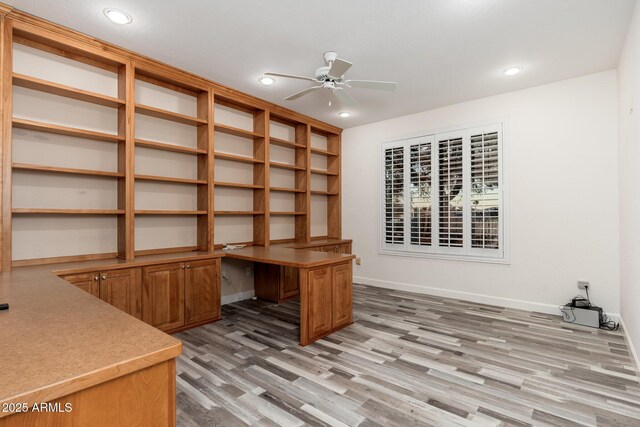15583 W Big Sky Dr, Surprise, AZ 85374 - office space with ceiling fan, built in desk, and light hardwood / wood-style flooring