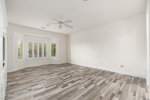 15583 W Big Sky Dr, Surprise, AZ 85374 - spare room featuring ceiling fan and light hardwood / wood-style floors