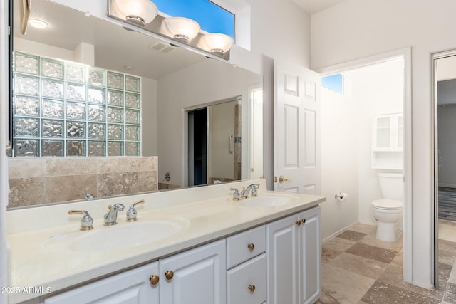 15583 W Big Sky Dr, Surprise, AZ 85374 - bathroom featuring vanity, toilet, and a wealth of natural light