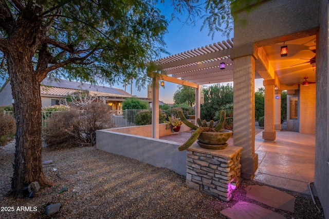 15583 W Big Sky Dr, Surprise, AZ 85374 - patio terrace at dusk with a pergola