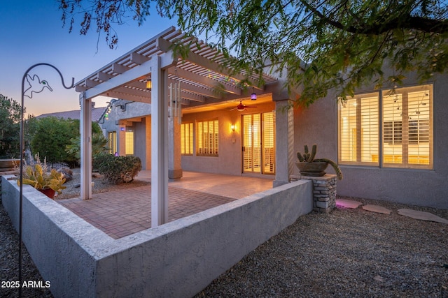 15583 W Big Sky Dr, Surprise, AZ 85374 - patio terrace at dusk featuring ceiling fan and a pergola